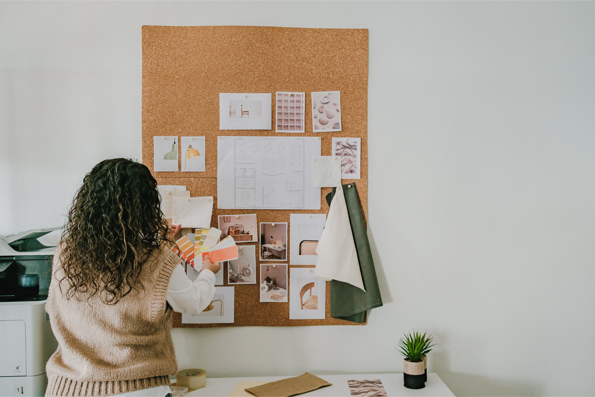 Designer organizing a product inspiration / mood board